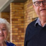 Parishioners standing together outside a church