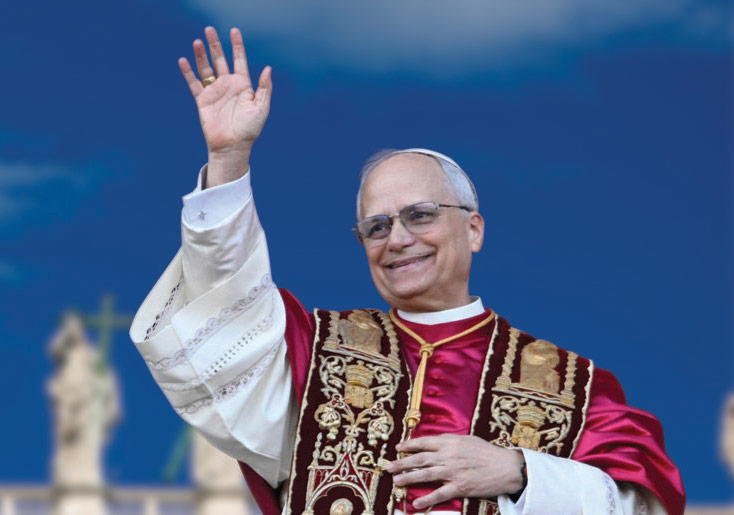 A smiling pope in red and gold vestments waving to the crowd